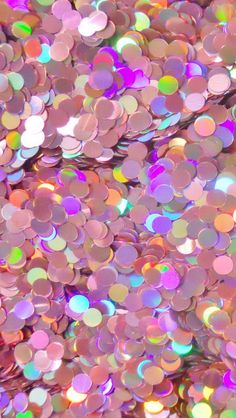 an image of many different colors of sequins