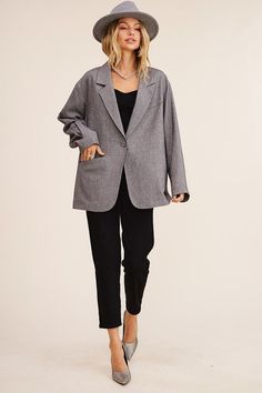 This blazer redefines elegance with its oversized silhouette that effortlessly bridges comfort and style. The welt pocket on the right front adds a touch of functionality and charm. The long sleeves offer versatility for various occasions, making it suitable for both formal and casual settings. With a clean and minimalistic design, the one-button closure provides a polished finish that complements the overall aesthetic. Model is 5' 9" 33-24-34 and wearing a size Small Fabric Contents: 57% Polyes Oversized Button-up Business Blazer, Oversized Lapel Collar Blazer For Office Wear, Oversized Blazer With Hidden Button Closure For Office, Oversized Button-up Blazer For Work, Oversized Single Button Workwear Blazer, Oversized Formal Blazer With Welt Pockets, Oversized Office Blazer With Welt Pockets, Oversized Single Button Blazer For Work, Oversized Linen Blazer For Workwear