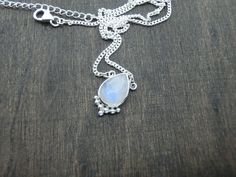 A feminine & timeless necklace with a drop-shaped Labradorite. The Labradorite is decorated with dotted details at the lower edge. It is made from solid 925 sterling silver. Perfect for layering or worn alone for a simple but stylish look. ～ A Stone of Magic, a crystal of shamans, diviners, healers & all who travel & embrace the universe seeking knowledge & guidance ～ Please note due to the nature of stones each piece will be unique & differ slightly to the images Size Guide: Bohemian Moonstone Teardrop Pendant Necklace, Bohemian Drop Necklace With Teardrop Gemstone Pendant, Bohemian Teardrop Pendant Drop Necklace With Gemstone, Bohemian Teardrop Gemstone Drop Necklace, Drop Necklace Silver, Seeking Knowledge, Timeless Necklace, Silver Drop Necklace, Labradorite Necklace