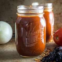 two mason jars filled with homemade tomato sauce