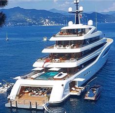 a large white boat floating on top of the ocean