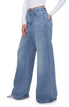 Glistening crystal embellishments dance in the light on these low-stretch wide-leg jeans featuring a faded indigo wash. 33" inseam; 25" leg opening; 13" front rise; 15 1/2" back rise (size 8) Zip fly with button closure Five-pocket style 79% cotton, 20% recycled cotton, 1% elastane Machine wash, tumble dry Imported Black Owned/Founded Rhinestone Denim Flare Jeans Straight Leg, Embellished Denim Blue Straight Leg Bottoms, Mid-rise Denim Flare Jeans With Rhinestones, Crystal Embellished Denim Jeans, Medium Wash Embellished Straight Leg Bottoms, Denim Blue Embellished Bottoms, Wide Leg Bottoms With Rhinestones For Spring, Wide-leg Rhinestone Bottoms For Spring, Spring Wide-leg Bottoms With Rhinestones