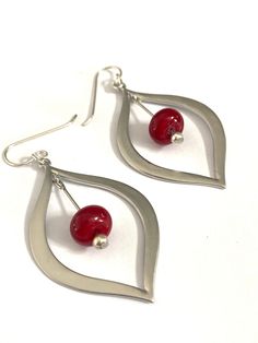 If you're searching for the perfect pair of red beaded earrings, these silver teardrop ones featuring my handmade glass beads in an opaque red color are the perfect, classy choice! I make the glass beads using a torch and kiln. I've used sterling silver ear wire and they come with ear nuts to keep them in place.  Materials: glass beads, sterling silver ear wire Length: 1.5 inches in length If you have questions or a special request, please click on the Message Seller button and I'll get back to Red Beaded Earrings, Red Bead Earrings, Jewelry For Mom, Glass Beads Jewelry, Handmade Glass Beads, Red Gift, Red Jewelry, Gift For Daughter, Earrings Red