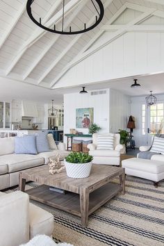 a living room filled with furniture and a wooden coffee table