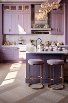 a kitchen with purple cabinets and stools