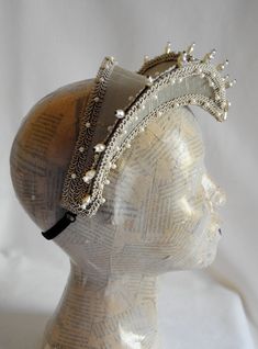 This glorious, renaissance attifet headdress will make an excellent addition to your historical costume. It is covered with beige silk shantung and embellished with beige trimming all around the edges.This unique piece wouldn't be complete without all those wonderful pearl bead details that add some royal flair to it's elegance. The headpiece is very light and comfortably stays in place with an adjustable elastic that goes under the hair and at the back of the neck. You can adjust the strap to b Elizabethan Costume, Hat French, Wedding Headdress, Beige Silk, Costume Hats, Historical Costume, Headdress, Pearl Beads, Festival Captain Hat