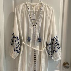 Beautiful White And Blue Embroidered Kaftan Dress By H & M Nwt Size Xs Has Balloon Style Sleeves With Button At End Small Side Slits Total Length 48” Under Arm Across Front 23” Belt Is Removable H&m Cotton Dresses For Vacation, H&m Long Sleeve Cotton Dresses, H&m Bohemian Spring Dresses, H&m Bohemian Long Sleeve Dresses, H&m Bohemian V-neck Dress, H&m Blue Beach Dress, White Cotton H&m Dresses, White H&m Beach Dress, White H&m Dress For Beach