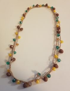 a necklace with beads and stones on it