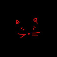 a black background with a red cat's face