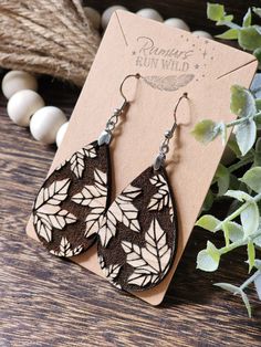 Cute Fall themed Wood Dangle Earrings for Her! These natural wood earrings are nature themed with the red oak and engraved Fall leaf design. Created in a teardrop shape for a simple shape that can go with any outfit. These Autumn earrings are perfect for a boho look for your sister, or as a gift for mom.  Created with nickel free, stainless steel earring hooks, and paired with a super lightweight wood, these are great for sensitive ears!  Size:  *Pendant Size: 1.75 inches long and 1.2 inches wid Fall Wood Earrings, Wood Burn Earrings, Handmade Gift For Mom, Autumn Earrings, Autumn Jewelry, Wood Dangle Earrings, Engraved Earrings, Diy Jewelry Inspiration, Wooden Necklace