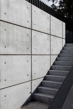 concrete wall with stairs leading up to it