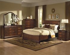 a bedroom scene with focus on the bed and dresser