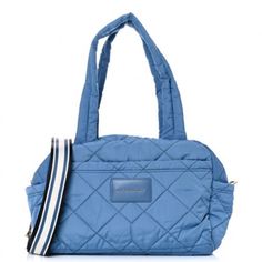 Fabric: Quilted Technical Weave Trolley Strap Exterior Patch And Zip Pockets Interior Zip Pockets Logo Patch With Raised Gold-Tone Lettering Zip At Top Optional, Adjustable Strap Lined Weight: 25oz / 0.71kg This Scaled-Down But Still Spacious Marc Jacobs Weekender Arrives In Quilted Nylon And Is Outfitted With A Handy Shoulder Strap. New With Tag Blue Quilted Bag For On-the-go, Blue Quilted Shoulder Bag For Everyday Use, Blue Quilted Travel Bags, Sporty Blue Tote Bag, Blue Quilted Tote Shoulder Bag, Blue Quilted Shoulder Bag For Travel, Blue Quilted Shoulder Bag For Daily Use, Sporty Blue Bag With Removable Pouch, Sporty Blue Tote Shoulder Bag