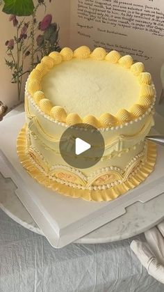 a yellow cake sitting on top of a white plate