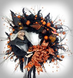 an image of a halloween wreath with witches and pumpkins