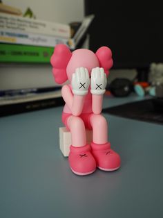 a pink toy sitting on top of a table