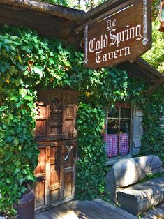 the old spring tavern is covered in ivy