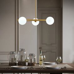 a dining room table with plates and glasses on it