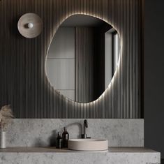 a bathroom with a sink, mirror and soap dispenser