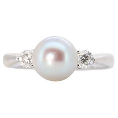 a white pearl and diamond ring