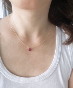 For dainty jewelry lovers, this minimalist necklace features an adorable genuine ruby stone hand wired onto a chain. It's great for wearing alone or layering with other necklaces, it will add a pop of color to any outfit!  {DETAILS} : - All components used are 14K gold filled or sterling silver to ensure this  is a quality piece. - Faceted ruby stone.  Stone will measure roughly 9X7 mm.  Some may be slightly larger or smaller. - Please convo me if you need multiple necklaces as bridesmaid gifts. Dainty Ruby Gemstone Birthstone Necklace, Dainty Ruby Gemstone Necklace, Ruby Birthstone Necklace As Gift, Red Dainty Birthstone Jewelry, Minimalist Red Gemstone Birthstone Necklace, Red Dainty Birthstone Necklace, Dainty Red Birthstone Jewelry, Dainty Red Birthstone Necklace, Dainty Adjustable Ruby Jewelry