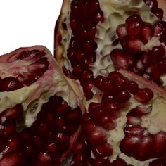 the pomegranate is cut open and ready to be eaten