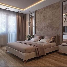 a bedroom with a large bed and wooden floors