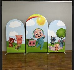 three children's bookshelves with cartoon characters on them