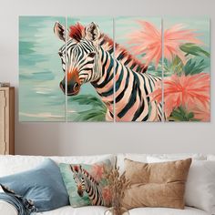 three paintings of zebras and pink flowers in a living room with white couches