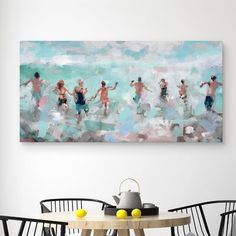 a painting hanging on the wall above a dining room table