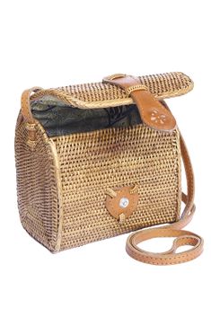 Small Basket bag, rattan ata shoulder cross-body straw basket. Perfect to carry your daily essentials, sunglasses, lipstick, cell phone and coin purse. (PRODUCT INFO): Size: 6" H x 6" W x 4" D/15cm H x 15cm W x 11cm D. Strap drop: 24" inches/60cm. Material: Handwoven Ata. Lining: Batik print cotton. Leather strap. Leather snap clasp closure. (SHIPPING INFO): All our items are made-to-order, therefore please allow 3-5 business days for production. Our goal is to become more sustainable throughout Brown Rectangular Portable Straw Bag, Rectangular Bucket Bag For Gifts, Travel Straw Bucket Bag With Phone Holder, Travel Bucket Straw Bag With Phone Pocket, Travel Bucket Straw Bag With Phone Holder, Travel Bucket Straw Bag With Mobile Phone Holder, Brown Bucket Straw Bag With Phone Holder, Travel Crossbody Bucket Bag With Bamboo Handle, Rectangular Mobile Phone Straw Bag For Travel