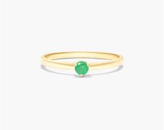 14K Yellow Gold 1.8mm Petite Single Emerald Birthstone Ring. If you're looking for your next staple piece, go green with May's birthstone - Emerald. Choose your own birthstone or mix and stack several of these petite rings for a fashionable and trendy look. Everyday Stackable Emerald Ring In Yellow Gold, Everyday Emerald Ring For May Birthstone, Green Birthstone Ring For Everyday Wear, Green Birthstone Ring For Everyday, Everyday Stackable Rings For May Birthstone, Everyday Yellow Gold Emerald Ring, Stackable Yellow Gold Emerald Birthstone Ring, Everyday Dainty Round Emerald Ring For May Birthstone, Everyday Solitaire Birthstone Ring For May