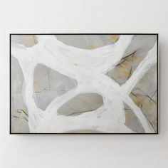 an abstract painting hangs on the wall above a bed in a white room with gray and yellow accents