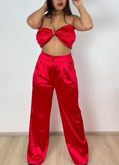 Detail - Satin Crop Top with gold chain halter and palazzo pants. Content + Care - 90% Polyester - 10% Spandex - Hand wash cold Size & Fit Model is 5'1" and wears size medium. Model Size Bust Waist 36in 28-30in Red Satin Party Bottoms, Two-piece Wide Leg Party Sets, Party Two-piece Wide Leg Sets, Party Wide-leg Two-piece Sets, Chic Satin Wide Leg Pants For Party, Chic Wide Leg Satin Pants For Party, Two-piece Wide Leg Sets For Night Out, Wide Leg Two-piece Party Bottoms, Red Wide Leg Pants For Night Out