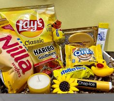 a basket filled with snacks and candles