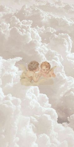 two little angels sitting in the clouds together