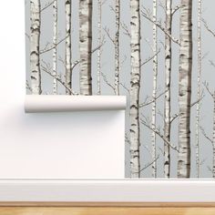 the wallpaper is in an empty room with white birch trees