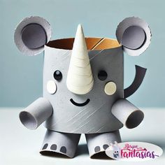 an elephant made out of toilet paper with a horn on it's head and eyes