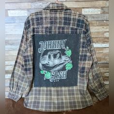 the back of a plaid shirt with an image of johnny cash on it