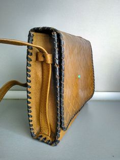 Vintage genuine leather bag - Retro leather bag - Old leather bag from 70' - Brown leather bag - Genuine Leather handbag - Shoulder bag Women shoulder bag made of genuine leather . In good vintage condition . Dimensions : 25.7 cm x 19.5 cm The length of the strap is 48 cm For other Vintage bags or Wallet please check here : https://www.etsy.com/shop/TheVINTAGEShopBG?ref=l2-shopheader-name&section_id=22456024 All pictures are real . You buy exactly what you see in the photos . Thank you for v Vintage Textured Leather Bags, Handheld Textured Leather Satchel, Vintage Leather Bag, Rectangular Shape, Vintage Leather Rectangular Bag, Textured Leather Rectangular Shoulder Bag For Office, Vintage Style Rectangular Leather Bag, Rectangular Flap Bag With Leather Lining For Everyday, Rectangular Leather Saddle Bag For Office, Square Leather Saddle Bag With Adjustable Strap