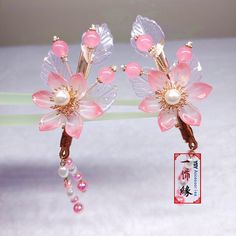 Product description: Name - A Pair of Handmade Pink Flower Hair Clip With Pearl Dangle, Chinese Traditional Hair Clip, Asian Hanfu Hair Clip, Bridal Golden Hair Clip Material Used - Copper; Glass Flower, Acrylic Pearl, Thread Color - Golden+ Pink Size: 2.5 x 1.5 inches Weight -1 OZ What is inside the shipping box - A hair Pin Now, "LEAVE YOUR MESSAGE" service is available for free.  Simply just leave what you want to say in the gift message section when checking out or email it to me.   I will write them on the designed gift papers and send it out along with the order.  Five Things about my hair accessories that I am proud of  1.100% handmade, I design and build. 2.High quality, All materials I use to make my hair accessories are carefully picked and tested by me.  Taking good care of a ha Pink Flower Hair Clip, Hanfu Hair, Pink Flower Hair, Wedding Barrettes, Flower Acrylic, Chinese Hair Accessories, Chinese Hairstyle, Copper Glass, Golden Hair