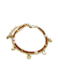 This beaded bracelet gives you the two-in-one layered look with a subtle shimmer of pearl and pops of gold. Perfect for adding to your favorite stack of layered wrist accessories. Seed beads, freshwater pearls, and brass 7" length Made fair trade in India by one of our longstanding production partners Pretty Earrings Dangle, Amber Bead Necklace, Large Statement Earrings, Wrist Accessories, Floral Studs, Silver Ring Set, Gold Flecks, Amber Beads, Minimal Jewelry