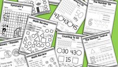 a pile of worksheets with numbers and shapes