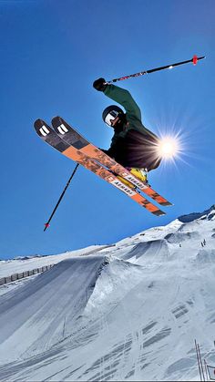 a man flying through the air while riding skis