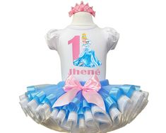 I offer you a beautiful birthday tutu outfit girls. NOTES FOR THE SELLER -Number for personalizing the top. -Name to personalize the vertex. -Need by date. Sleeve for the top - short, long. TOP. The top of it is 100% cotton. Size 3-24 months it is a bodysuit, 2T-10T it is a shirt. (Since it is more handmade always remember the shirt needs to be washed inside out, hand washed and air dried). SKIRT - made of soft tulle, edged at the bottom with a ribbon and decorated with a bow. Tutu is planted on Princess Style White Tutu Dress For First Birthday, Blue Princess Tutu Dress For First Birthday, Princess Style Blue Tutu Dress For First Birthday, White Princess Dress For Birthday, Princess Style Fitted Tutu Dress For Birthday, White Fitted Tutu Dress For Birthday, Birthday Tutu Outfit, Beautiful Birthday, Tutu Outfits