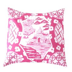 a pink and white pillow with an image of a castle in the middle on it