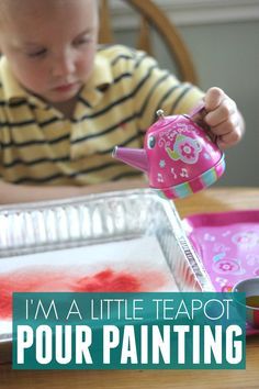 a young child is pouring red liquid into a container with the words, i'm a little teapot pour painting