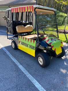 a colorful golf cart parked in front of a house