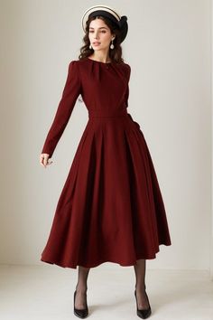 Burgundy long sleeve wool swing dress with a stylish folded neckline. This dress effortlessly blends elegance and comfort. The flared silhouette offers a graceful and flattering fit, while the high-quality wool fabric ensures warmth and softness. The folded neckline adds a touch of sophistication to this versatile dress, perfect for various occasions. DETAIL * 30% wool, 30% fiber, 40% polyester * fully satiny lining, more nice to the touch body * Round pleated neckline * Long sleeves * Fit and flare dress * Back zipper closure * Two side seam pockets * Below the knee length  * Lean More about the items From the FAQs on the page bottom MODEL SIZE Bust 85 cm(33.4")  Waist 67 cm(26.7")  Height 168cm (5' 6") She wears size XS Choose CUSTOM Order if you * Need a better fit * Can't find your siz Winter Dress Vintage, Christmas Dress Women Classy, Red Winter Dresses, Maroon Dress, Fall Winter Dresses, Versatile Dresses, Wool Dress, Christmas Dress, Winter Dresses