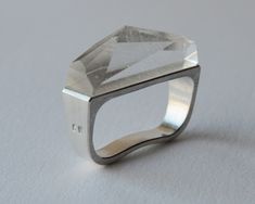 This avant garde unisex ring is a double finger ring that is made from silver and polished transparent glass bar. The ring is geometric shaped. Brutally honest and bold aesthetics of this ring is what makes it so special Double finger silver ring with faceted glass. Double rings are measured as two separate individual ring sizes (please see the photos of the product - explaining visualization). The ring in photos is size US 7 and US 8  Ring width is 6 to 10 mm Ring weight is 30 grams This ring o Outlander Style, Two Finger Ring, Hand Carved Ring, Double Finger Ring, Double Rings, Gifts For Hubby, Urban Outfitters Jewelry, Carved Ring, Glass Bar